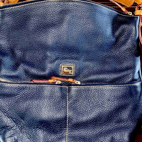Navy Blue never been used Dooney & Burke Tote.The tags are still attached.
